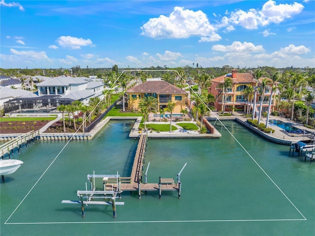 birds eye view of property with a water view and a residential view