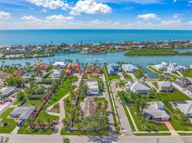 aerial view featuring a water view and a residential view