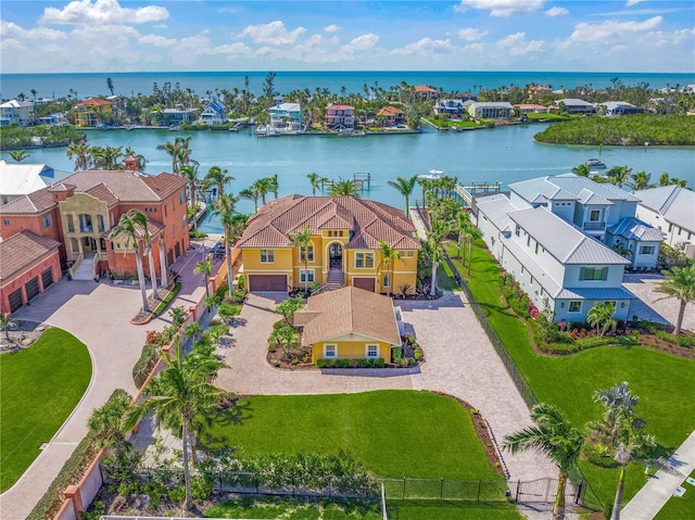 drone / aerial view with a residential view and a water view