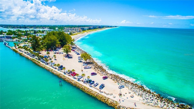 bird's eye view with a water view and a view of the beach