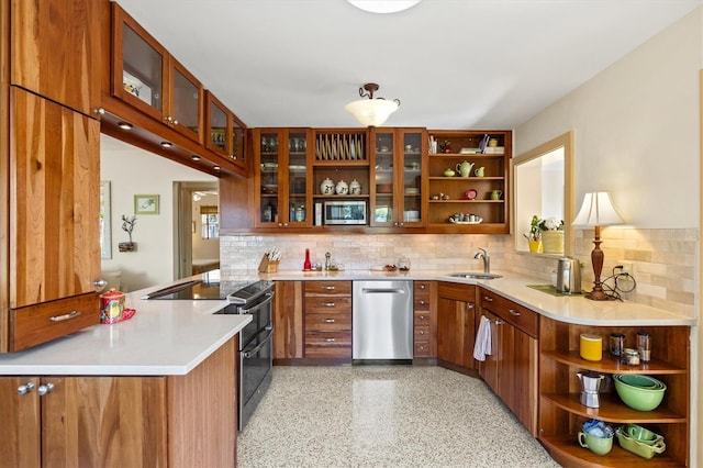 kitchen featuring open shelves, stainless steel appliances, brown cabinetry, and a sink