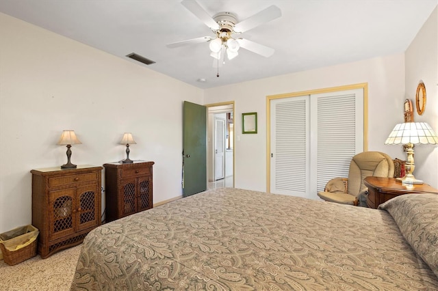 bedroom featuring a closet, visible vents, and a ceiling fan