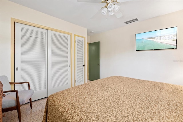 bedroom with visible vents, a closet, and a ceiling fan