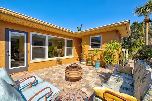 view of patio / terrace with a fire pit