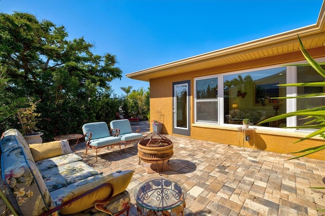 view of patio / terrace with a fire pit