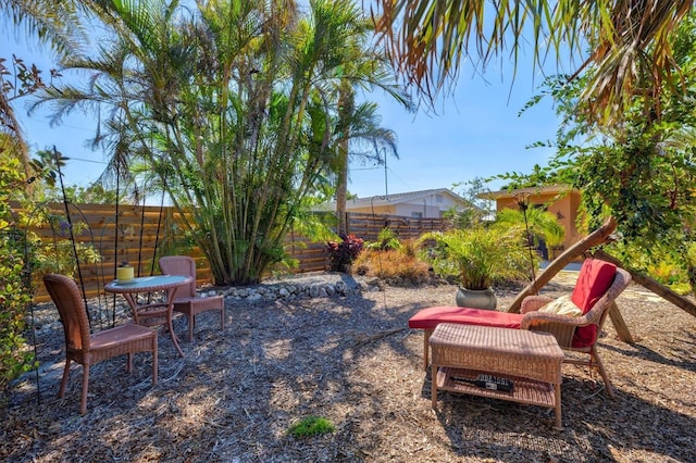 view of yard featuring a patio area and fence