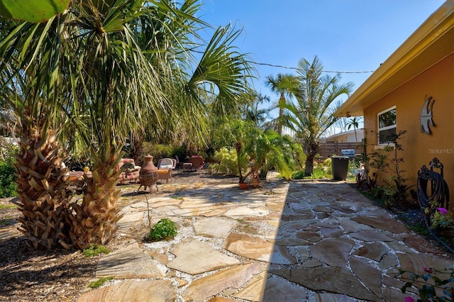 view of patio featuring fence