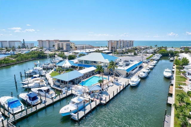 drone / aerial view with a city view and a water view