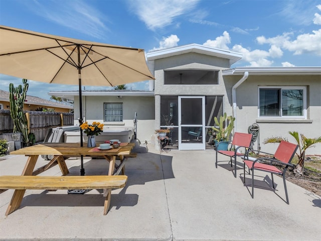 back of property featuring a patio, fence, and stucco siding