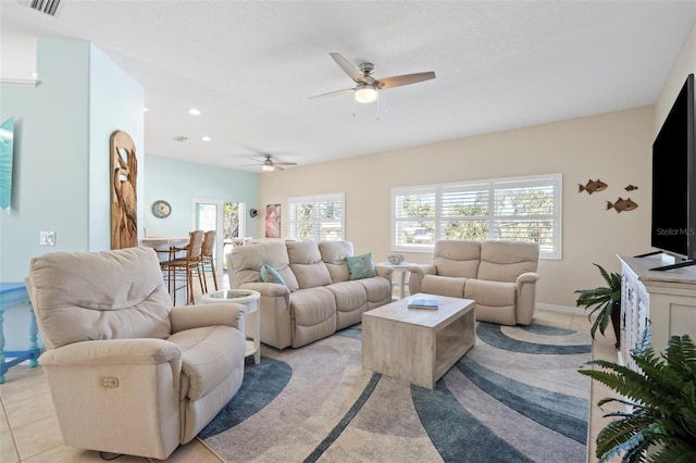 living area with light tile patterned floors, recessed lighting, visible vents, a ceiling fan, and baseboards