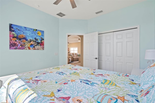 bedroom with a ceiling fan, visible vents, and a closet