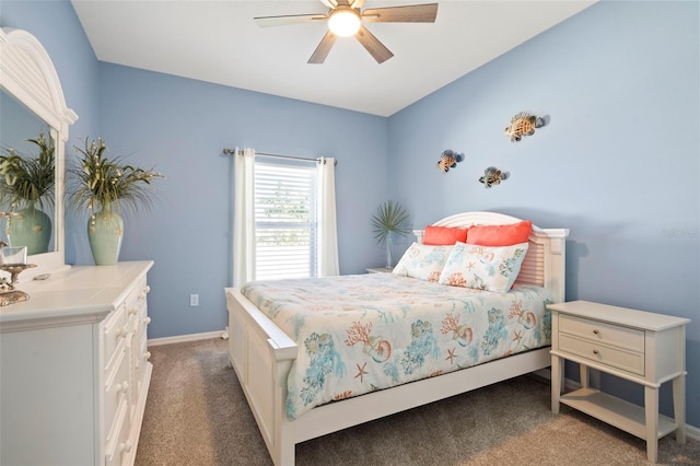 bedroom featuring baseboards, dark carpet, and ceiling fan