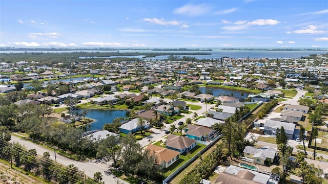 aerial view with a water view and a residential view