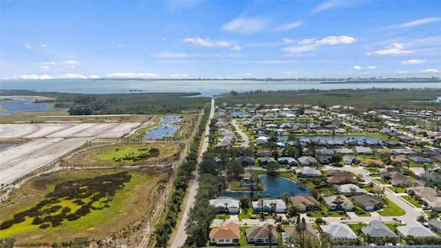 aerial view featuring a water view and a residential view