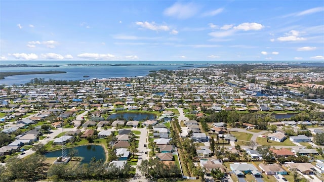 aerial view featuring a residential view and a water view