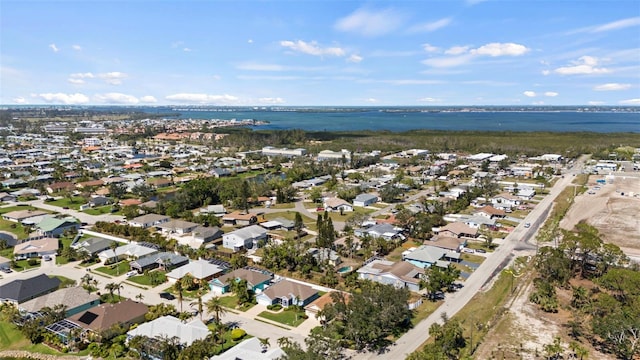 drone / aerial view featuring a water view and a residential view