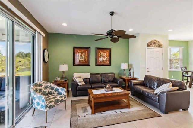 living area with light tile patterned floors and recessed lighting