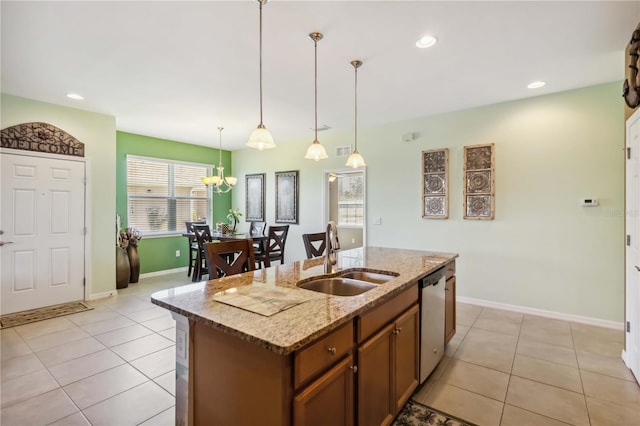 kitchen with decorative light fixtures, recessed lighting, stainless steel dishwasher, light tile patterned flooring, and a sink