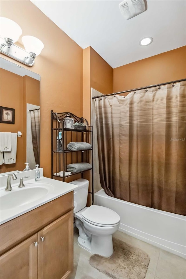 bathroom featuring visible vents, toilet, tile patterned flooring, shower / bath combination with curtain, and vanity