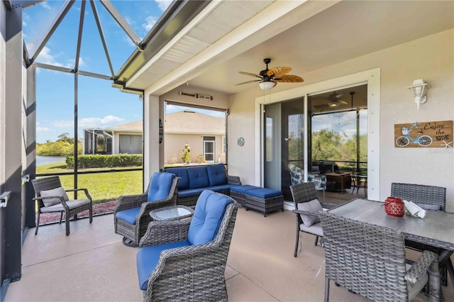 view of patio / terrace featuring a lanai, outdoor lounge area, and ceiling fan