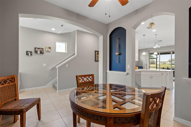 1050 Jonah Dr, North Port, FL 34289 - dining area featuring light tile patterned floors, visible vents, baseboards, and a ceiling fan