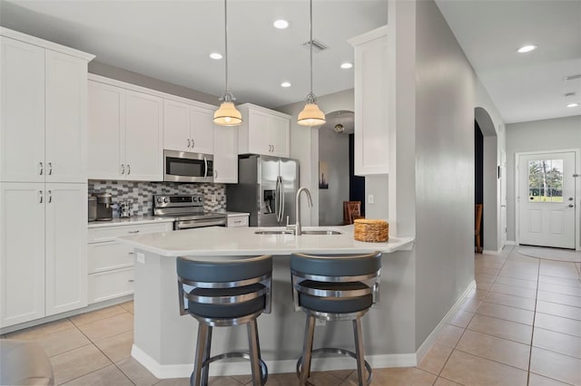 1050 Jonah Dr, North Port, FL 34289 - kitchen featuring appliances with stainless steel finishes, visible vents, a sink, and light tile patterned floors