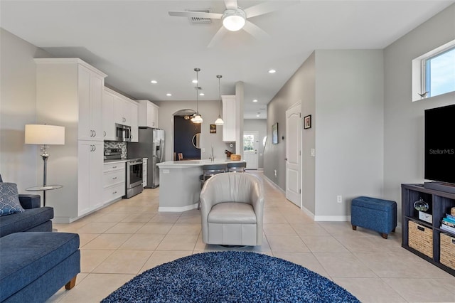 1050 Jonah Dr, North Port, FL 34289 - interior space featuring light tile patterned floors, recessed lighting, visible vents, baseboards, and a ceiling fan