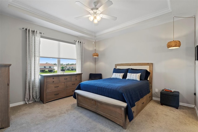 1050 Jonah Dr, North Port, FL 34289 - bedroom featuring ceiling fan, light carpet, baseboards, a raised ceiling, and crown molding