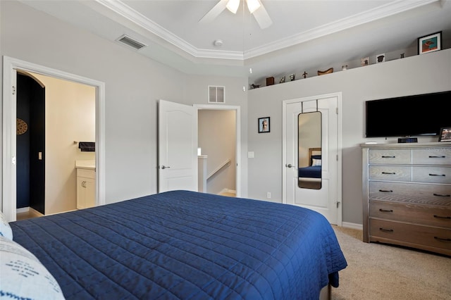 1050 Jonah Dr, North Port, FL 34289 - bedroom with light carpet, a tray ceiling, ornamental molding, and visible vents
