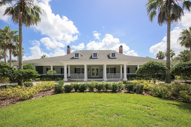 1050 Jonah Dr, North Port, FL 34289 - back of property featuring a chimney and a lawn