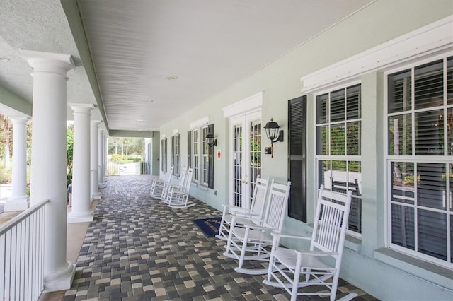 1050 Jonah Dr, North Port, FL 34289 - view of patio with covered porch and french doors