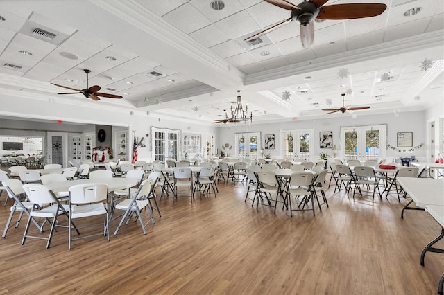 1050 Jonah Dr, North Port, FL 34289 - dining space featuring french doors, wood finished floors, visible vents, and crown molding