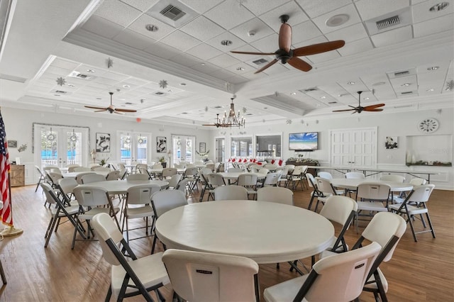 1050 Jonah Dr, North Port, FL 34289 - dining area with visible vents, french doors, wood finished floors, and ornamental molding
