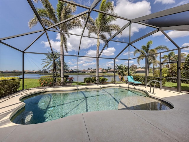 outdoor pool with a lanai, a patio area, and a water view