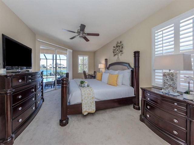 bedroom featuring a ceiling fan, access to exterior, and light colored carpet