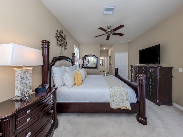 bedroom with light carpet, ceiling fan, and visible vents