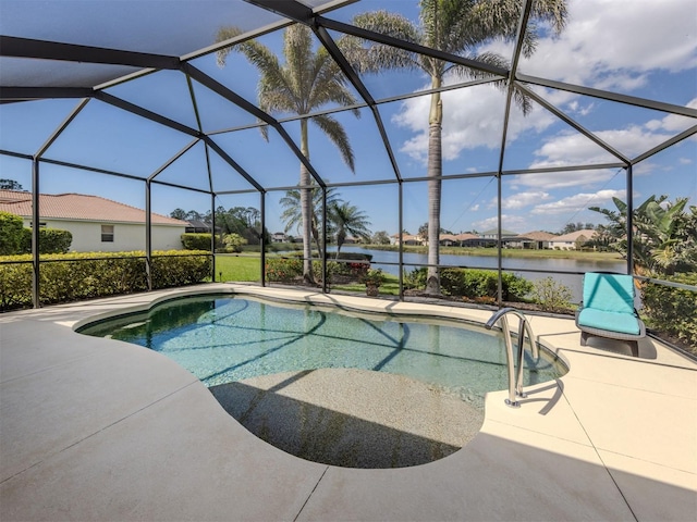 outdoor pool featuring a lanai, a water view, and a patio