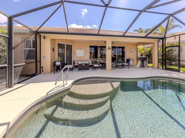 pool featuring a patio, area for grilling, and an outdoor hangout area