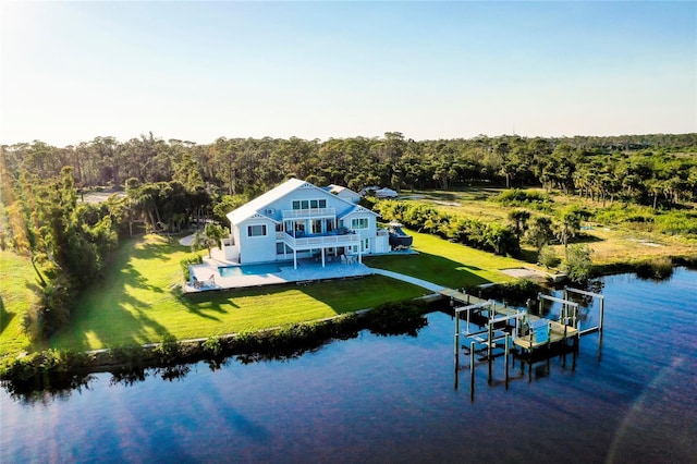 drone / aerial view with a water view and a wooded view