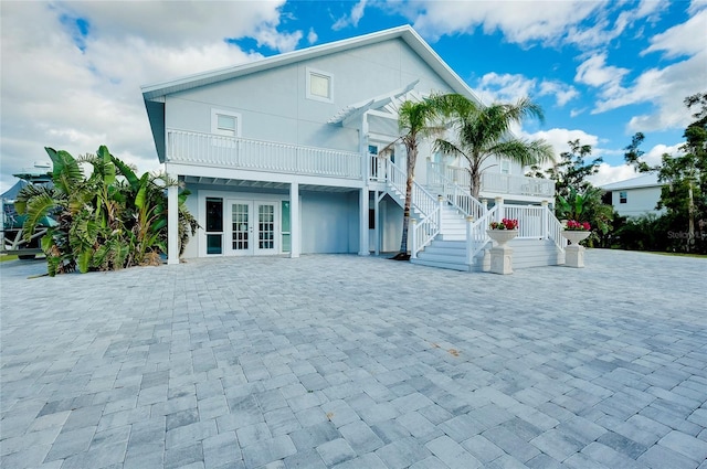 exterior space with french doors and stairway