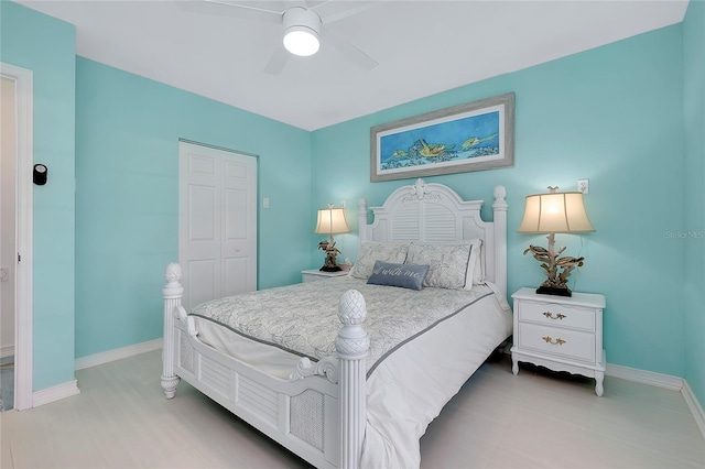 bedroom featuring a ceiling fan and baseboards