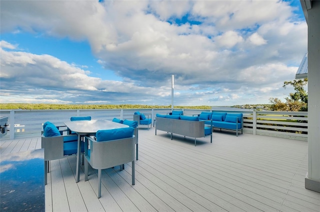 wooden deck featuring outdoor dining area, outdoor lounge area, and a water view