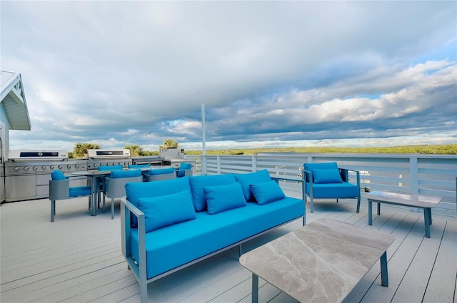 wooden deck featuring a grill and an outdoor living space