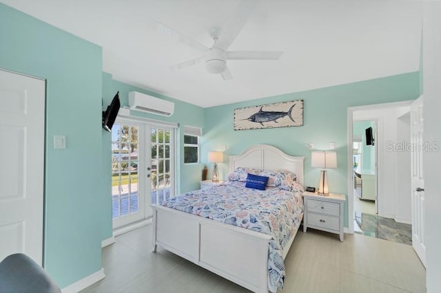 bedroom featuring a ceiling fan, baseboards, access to outside, french doors, and a wall mounted air conditioner