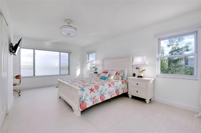 bedroom featuring baseboards