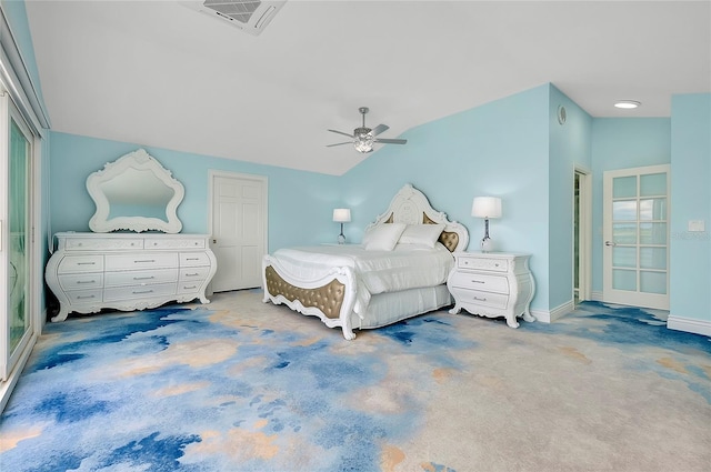 bedroom featuring carpet, visible vents, vaulted ceiling, and a ceiling fan