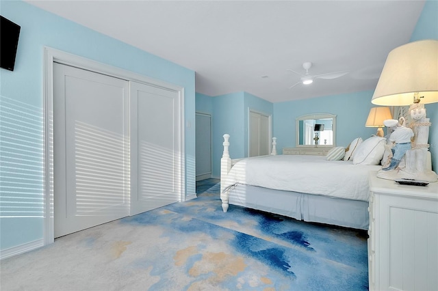 carpeted bedroom with a ceiling fan