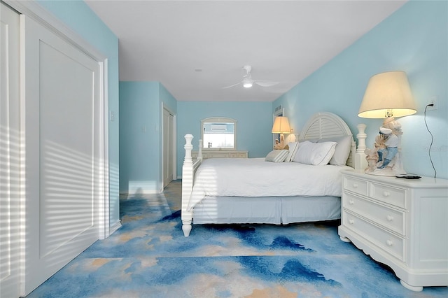 bedroom featuring concrete flooring and a ceiling fan