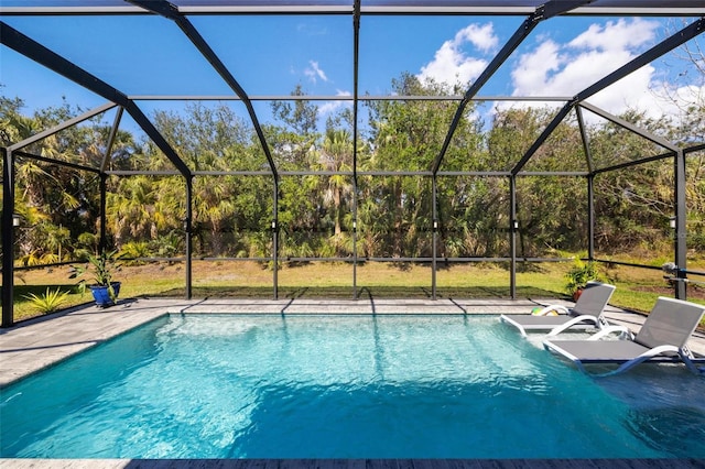 pool with a lanai and a patio