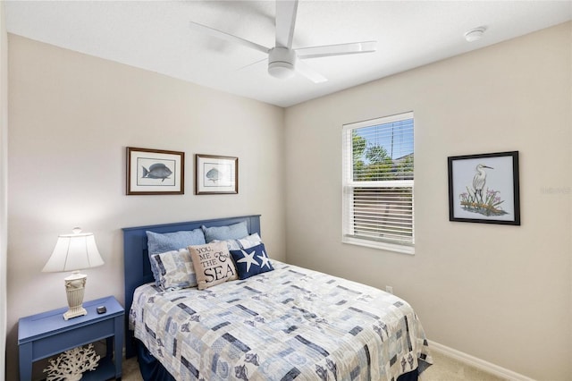 carpeted bedroom featuring ceiling fan and baseboards